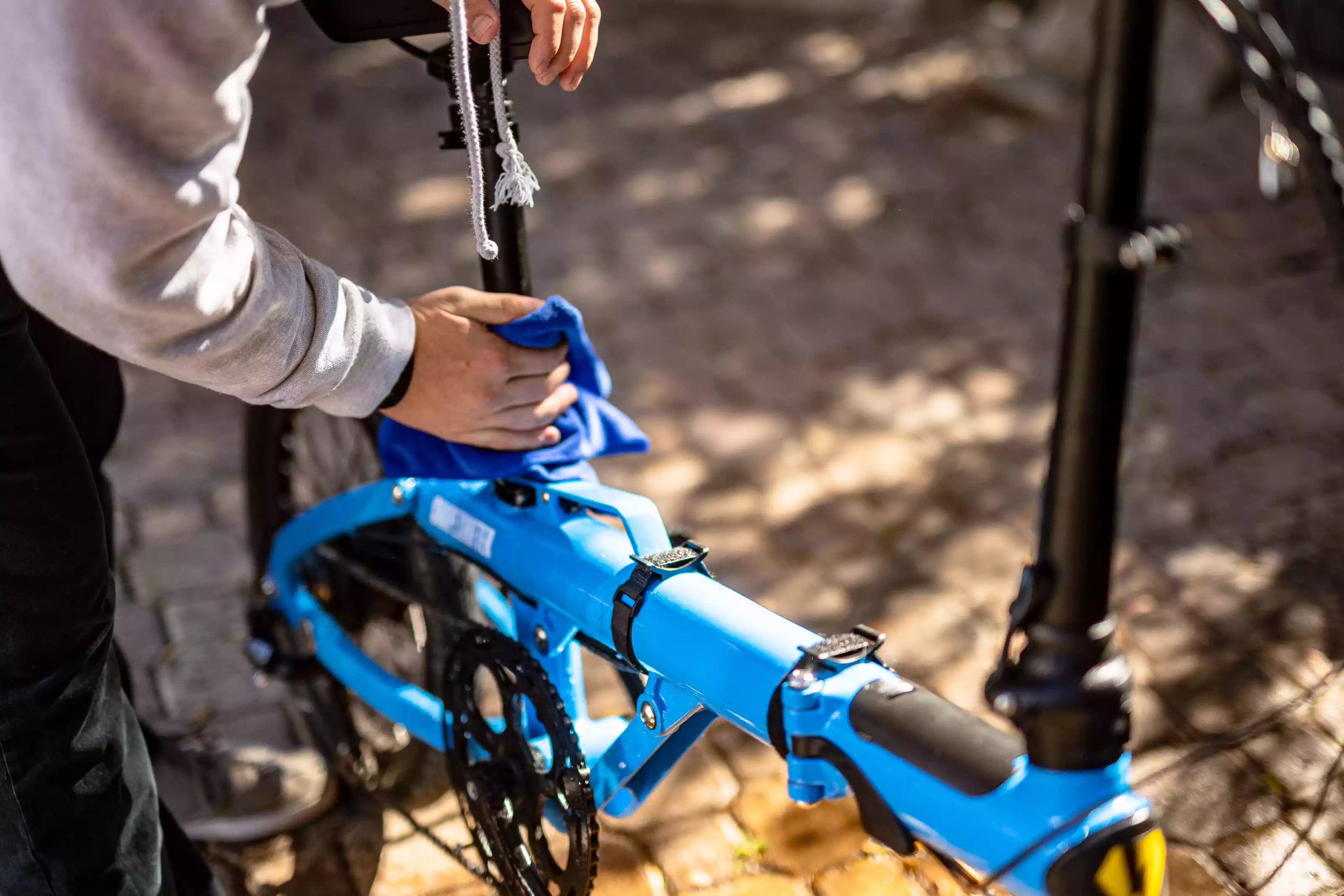 how to clean ebike - wiping down ebike with microfiber towel