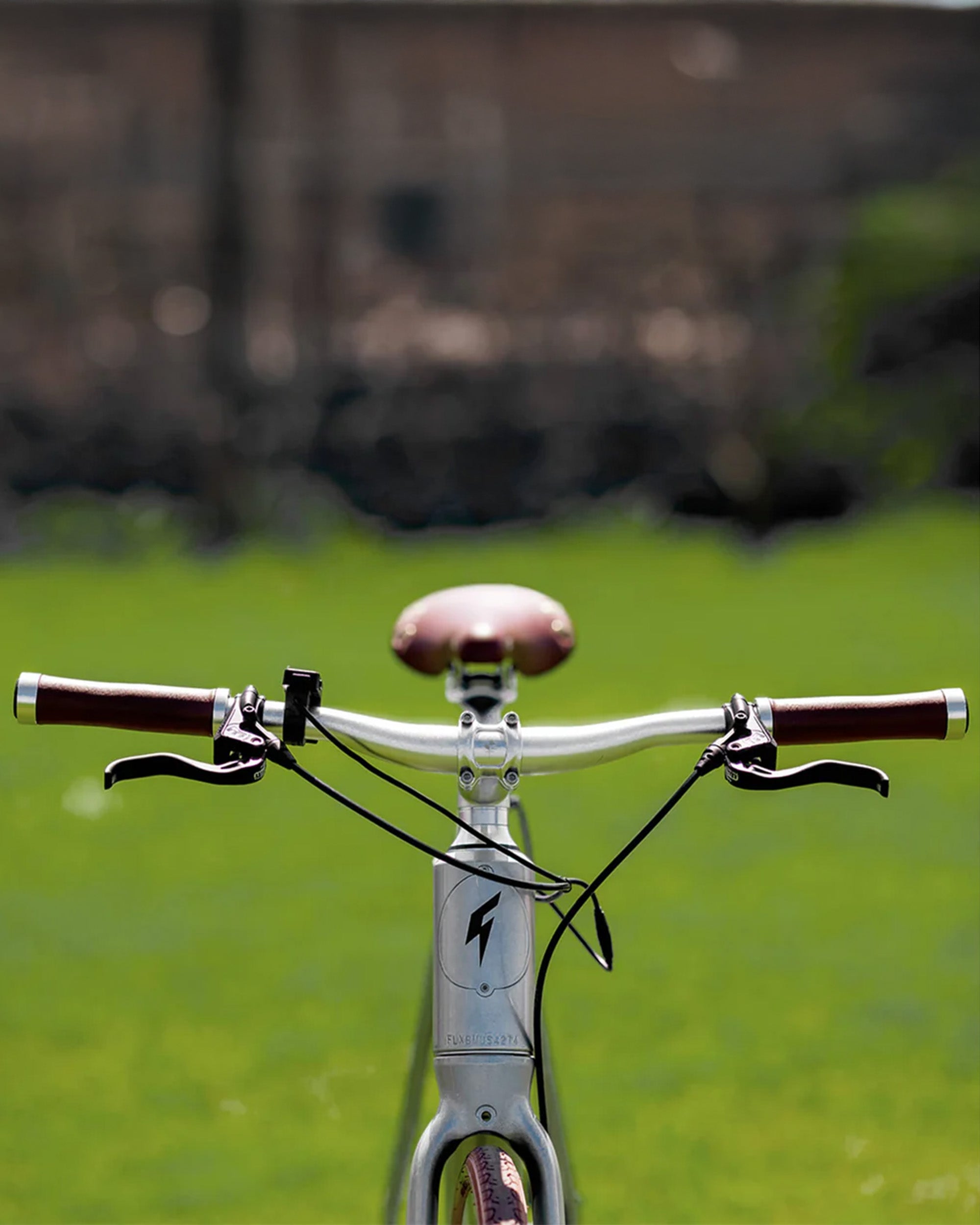 superhuman electric bike with green grass backround