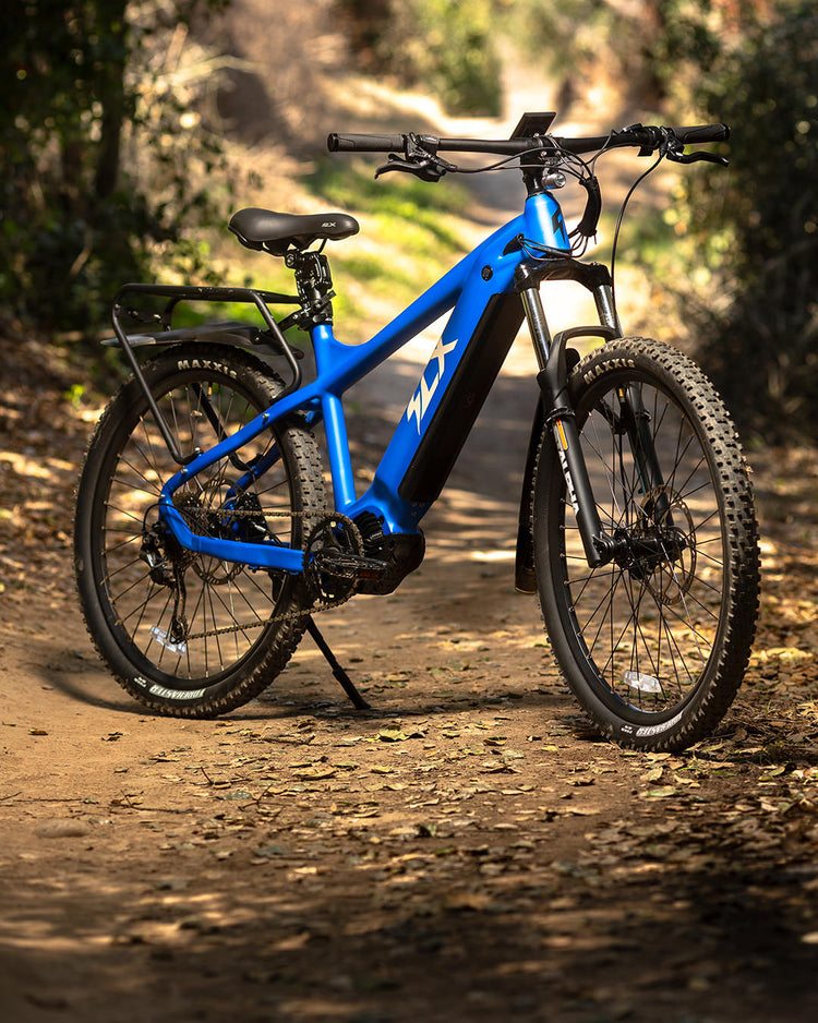 Blue electric mountainbike standing on a trail